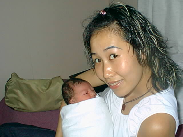 Jessica Tam with me at hospital when I'm one day old.